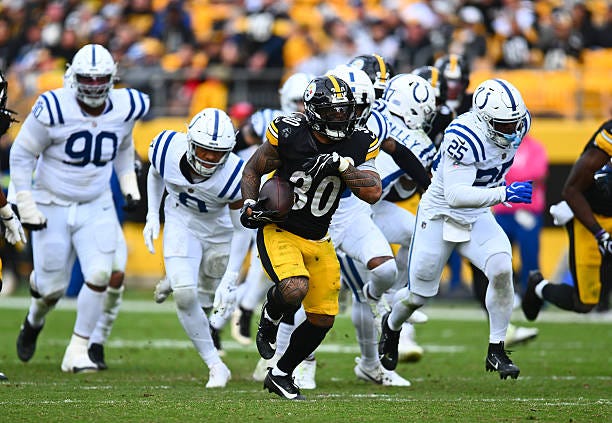 Jaylen Warren of the Pittsburgh Steelers rushes for a 50 yard touchdown during the third quarter against the Indianapolis Colts at Acrisure Stadium...