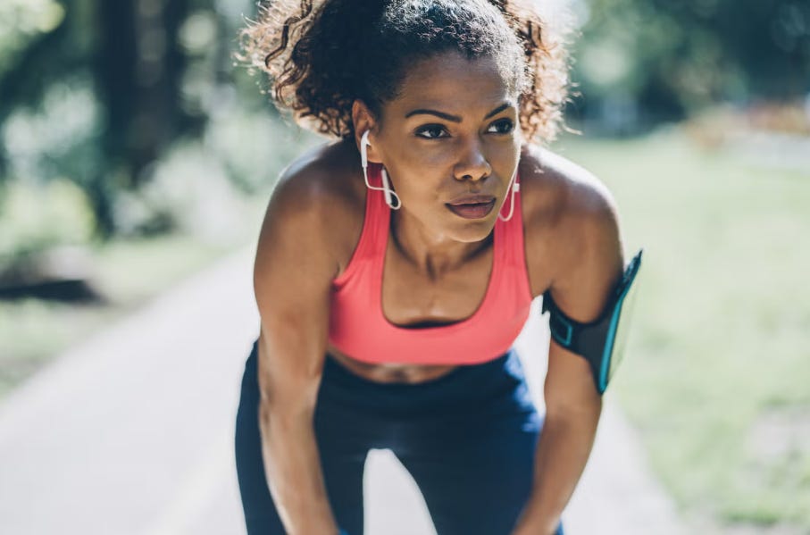 Woman runner focused on a trail