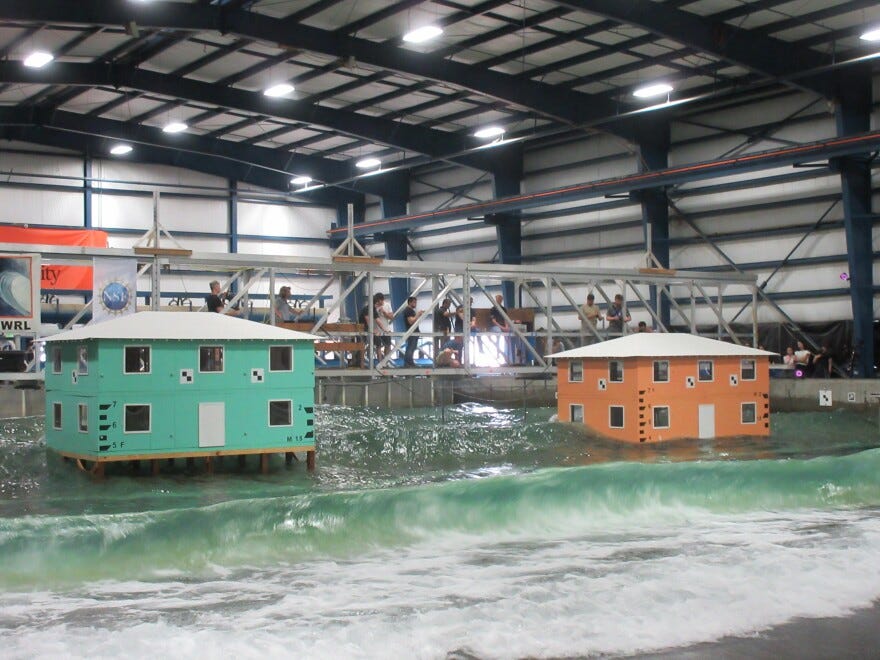 By the end of the experiment, researchers increased the waves to a height of 50 centimeters, pictured on Aug. 6, 2025. Water flooded into the orange house through missing windows and wall panels.