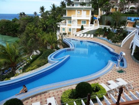 The dolphin-shape swimming pool. - Picture of Monaco Suites de Boracay,  Panay Island - Tripadvisor