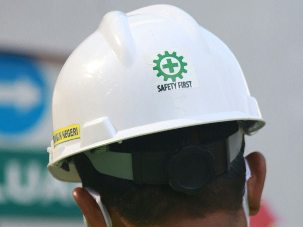 Person wearing a hard hat as Anthropic builds an army of autonomous AI agents with a singular mission: to audit powerful models like Claude to improve safety.