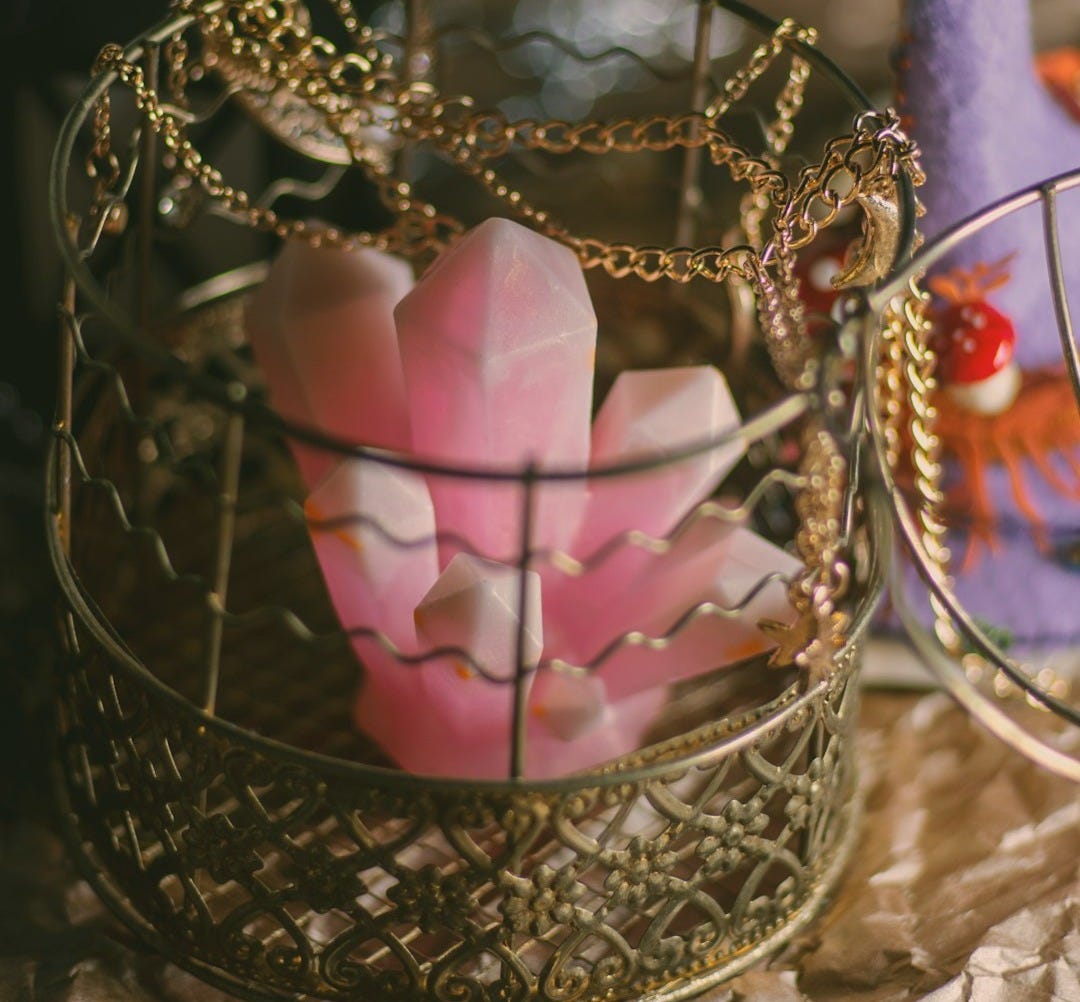 a gold and purple heart shaped object