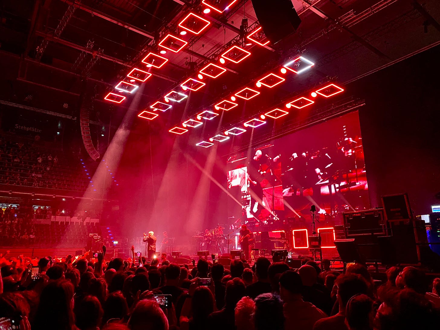The National on stage, bathed in red lights, playing Bloodbuzz Ohio in Berlin on September 30.