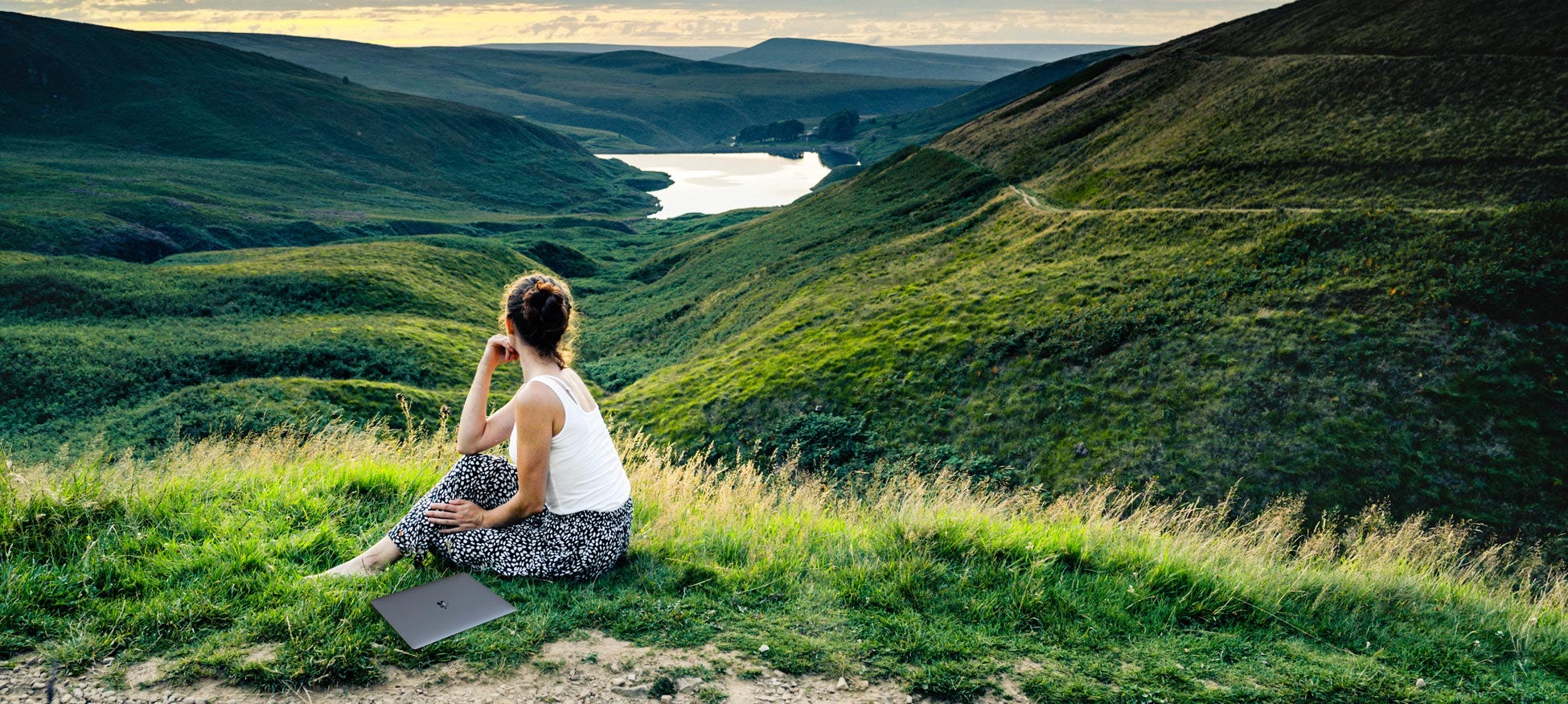 Woman walking near the Lake District, getting inspired.