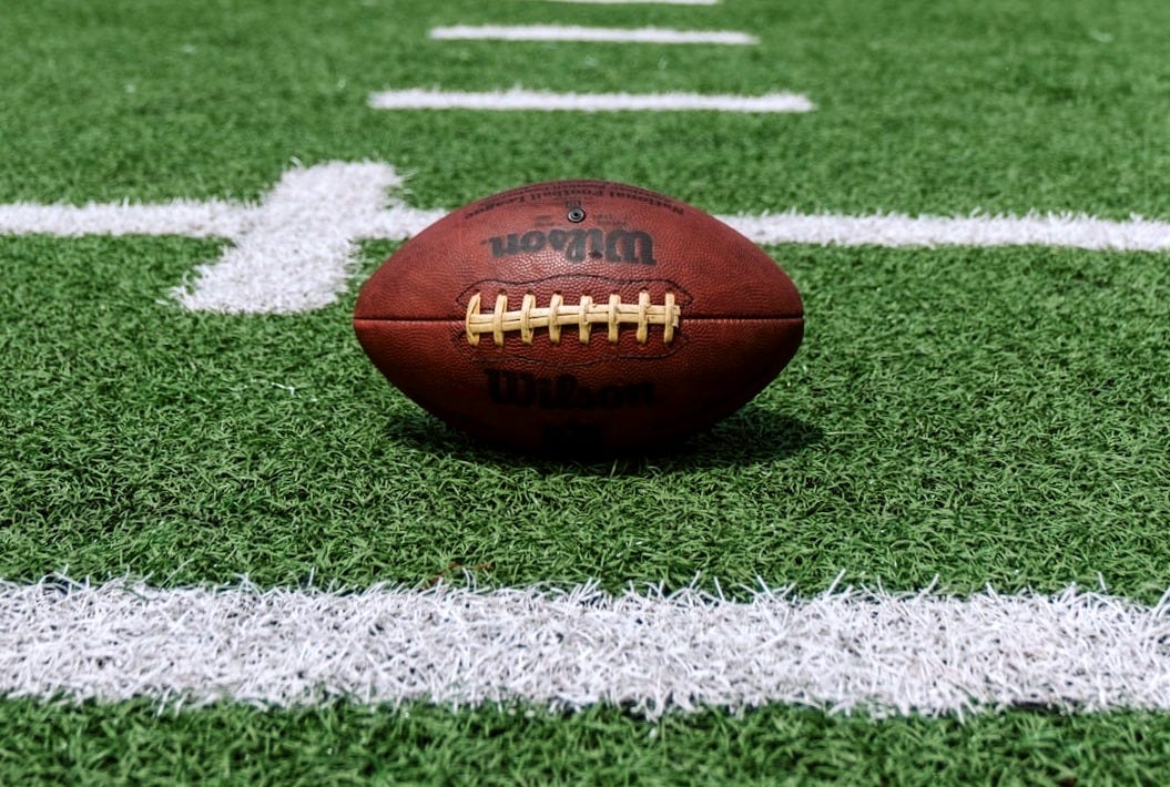 brown and black Wilson football