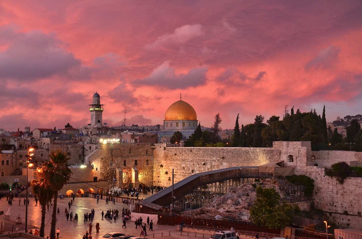 Beautiful sunset over Jerusalem’s Old City with religious landmarks visible
