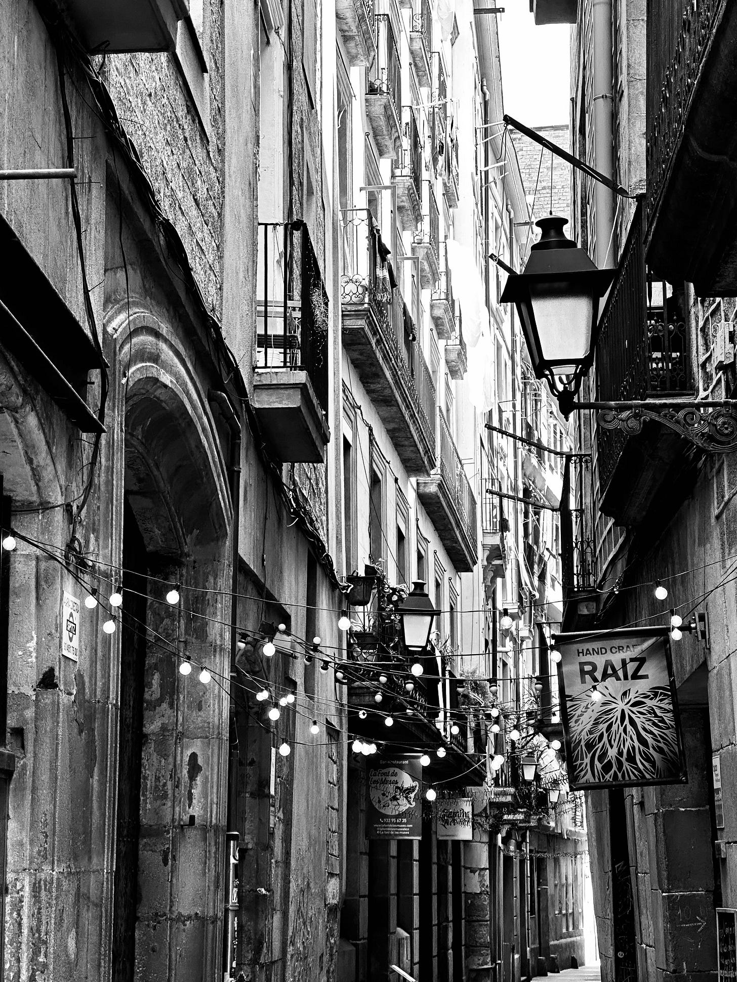 Illuminated Alleys: A Barcelona Nocturne in Monochrome Illuminated Alleys: A Barcelona Nocturne in Monochrome