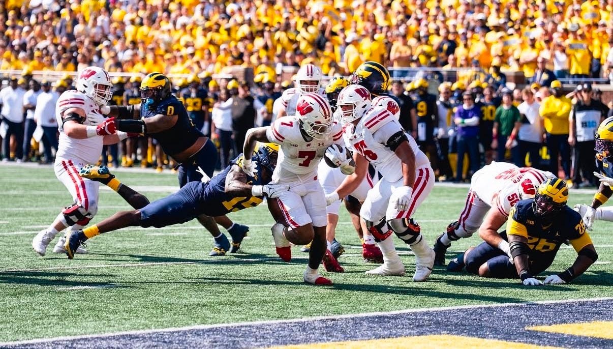 Wisconsin running back Dilin Jones (7) runs into the end zone for a touchdown against Michigan on the road in Ann Arbor.