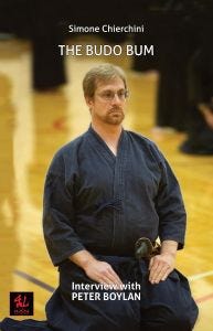 Image of the cover of THe Budo Bum. Peter Boylan in seza before beginning an iai kata. Image of the cover of THe Budo Bum. Peter Boylan in seza before beginning an iai kata.