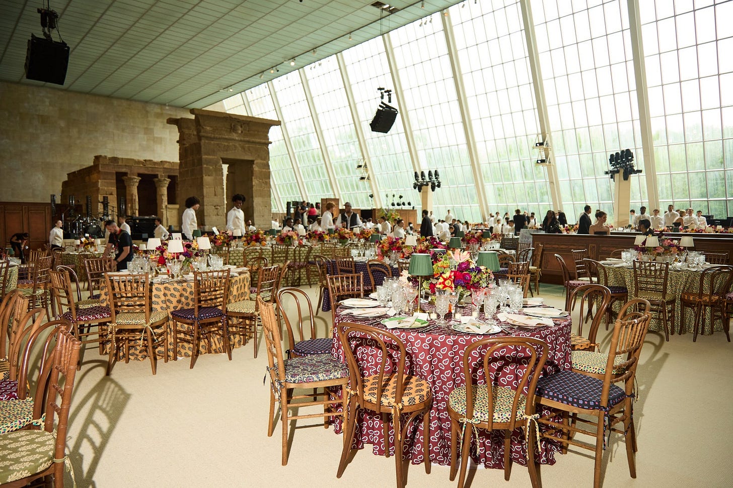 Image may contain Dining Table Furniture Table Indoors Architecture Building Dining Room Room Person and Chair