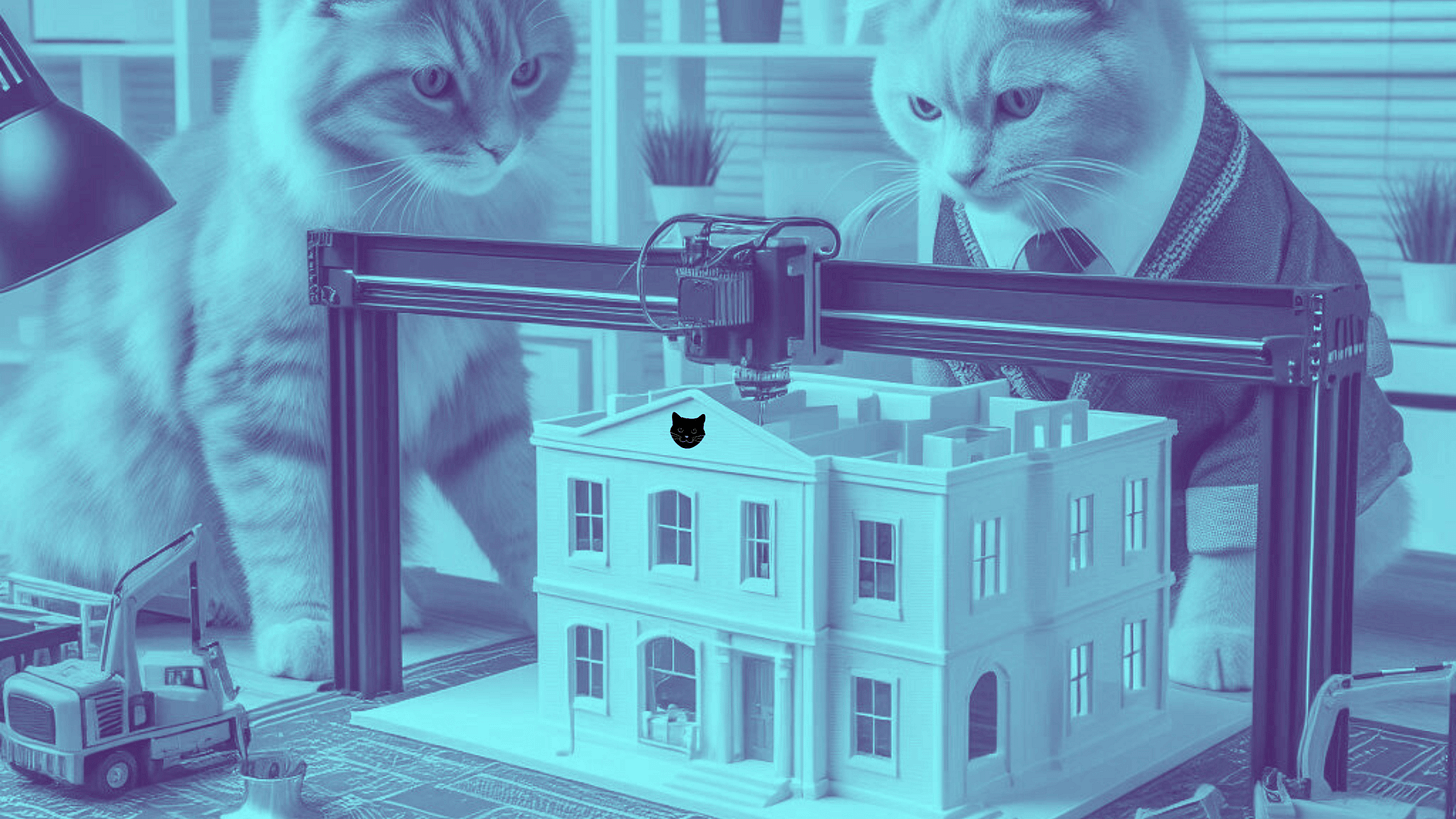 Image of two cats supervising a 3D printing project