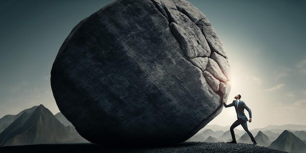A man is pushing a large rock with the words brain on it ...