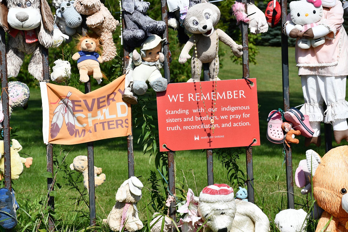 A small shrine set up, toys and messages left tied to a fence in honor of the missing and murdered Indigenous people that suffered in Canada’s genocide. A small shrine set up, toys and messages left tied to a fence in honor of the missing and murdered Indigenous people that suffered in Canada’s genocide.