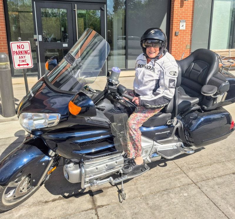 Rheva Frank on a motorcycle