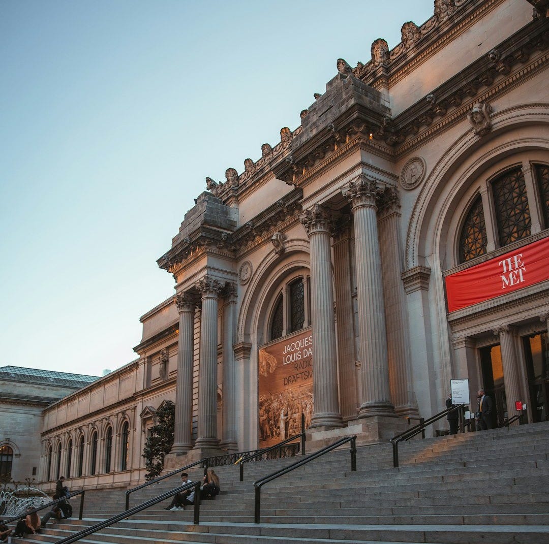 a building with pillars and stairs