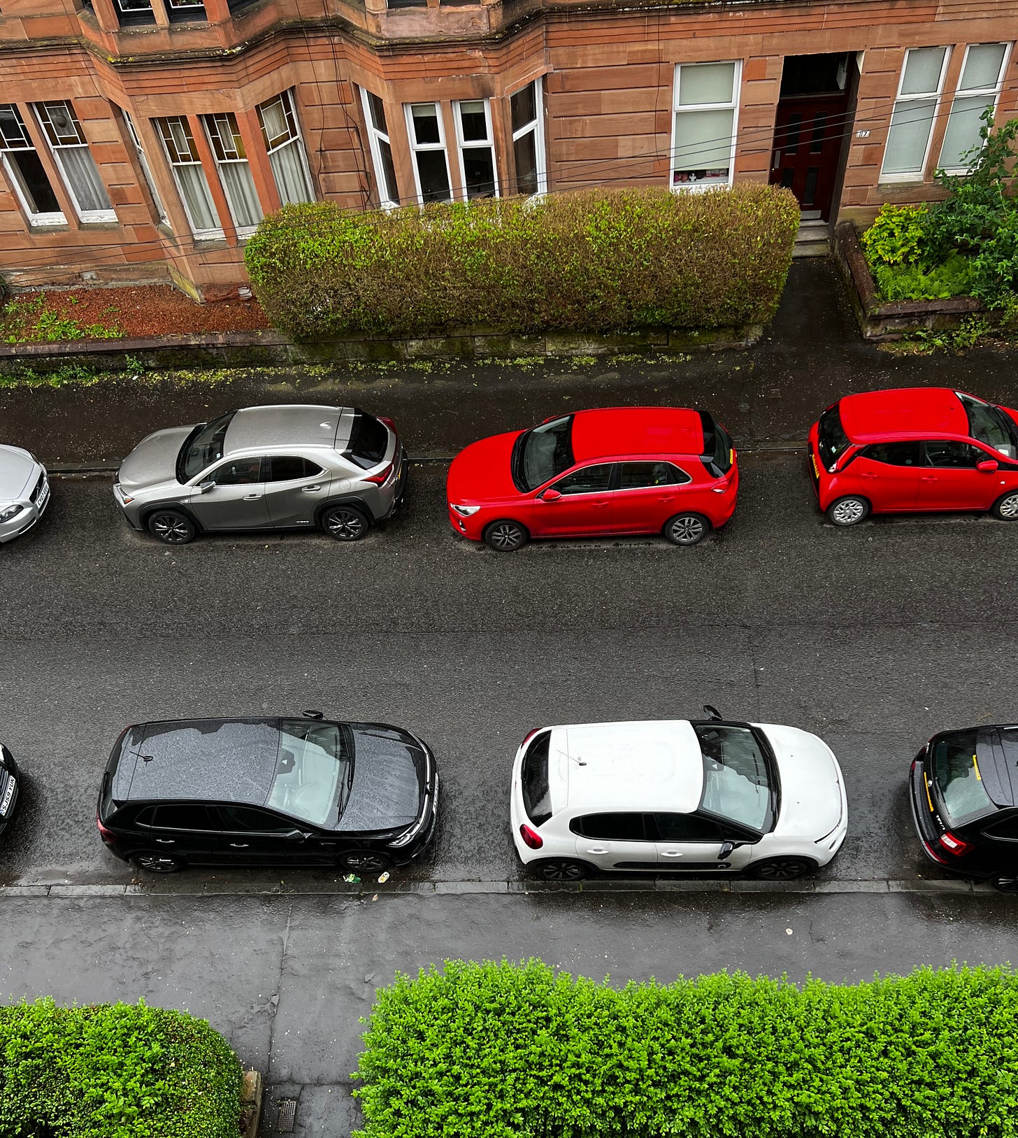 Road with cars parked either side