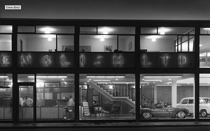 Night time photos of F English Ford dealership. Morernist architecture