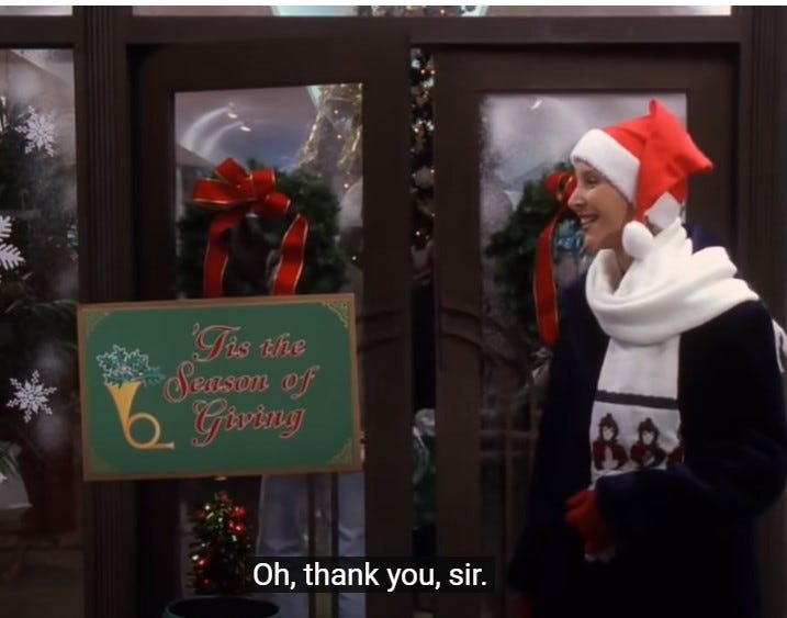 The character Phoebe Buffay from Friends is ringing a bell in a holiday scene, trying to encourage passers-by to donate The character Phoebe Buffay from Friends is ringing a bell in a holiday scene, trying to encourage passers-by to donate