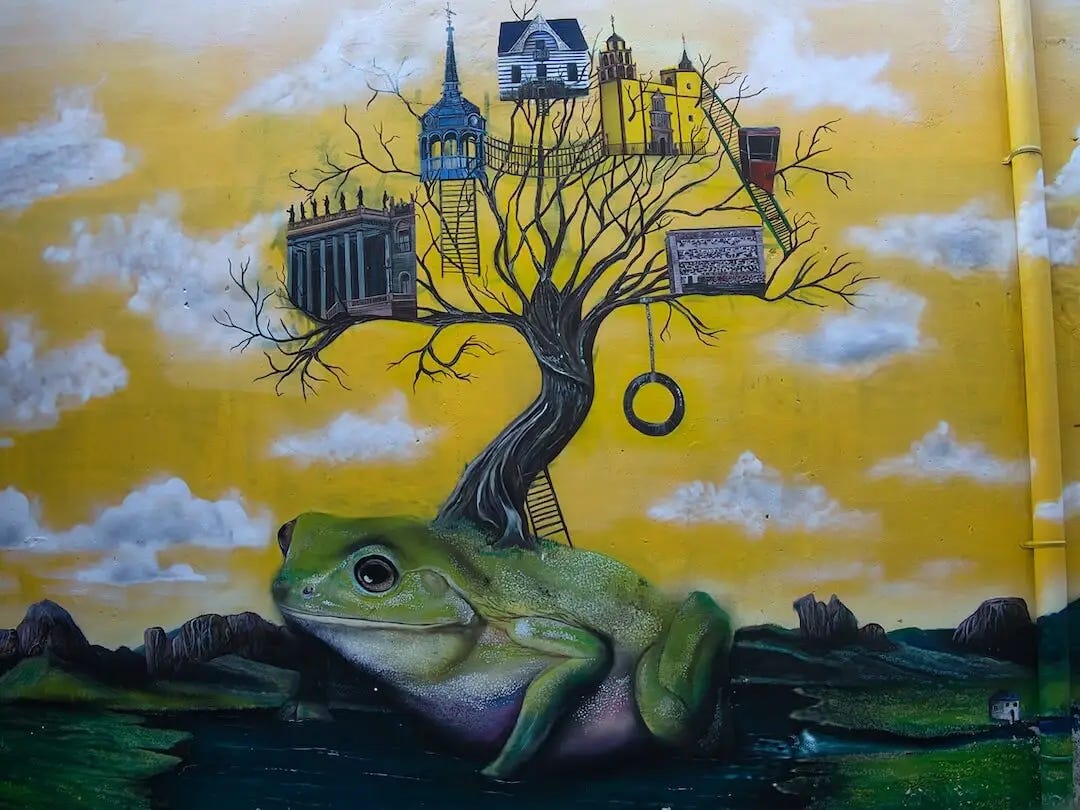 Street art - a frog with a tree growing from its back