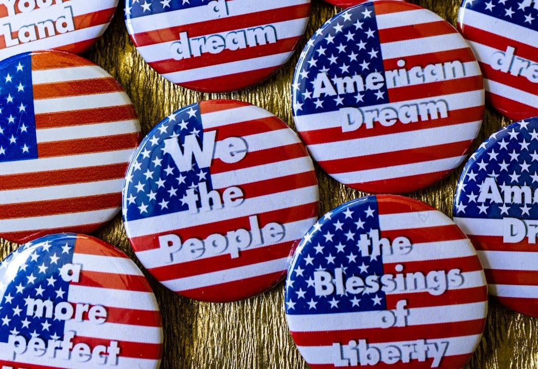 A bunch of buttons with american flags on them