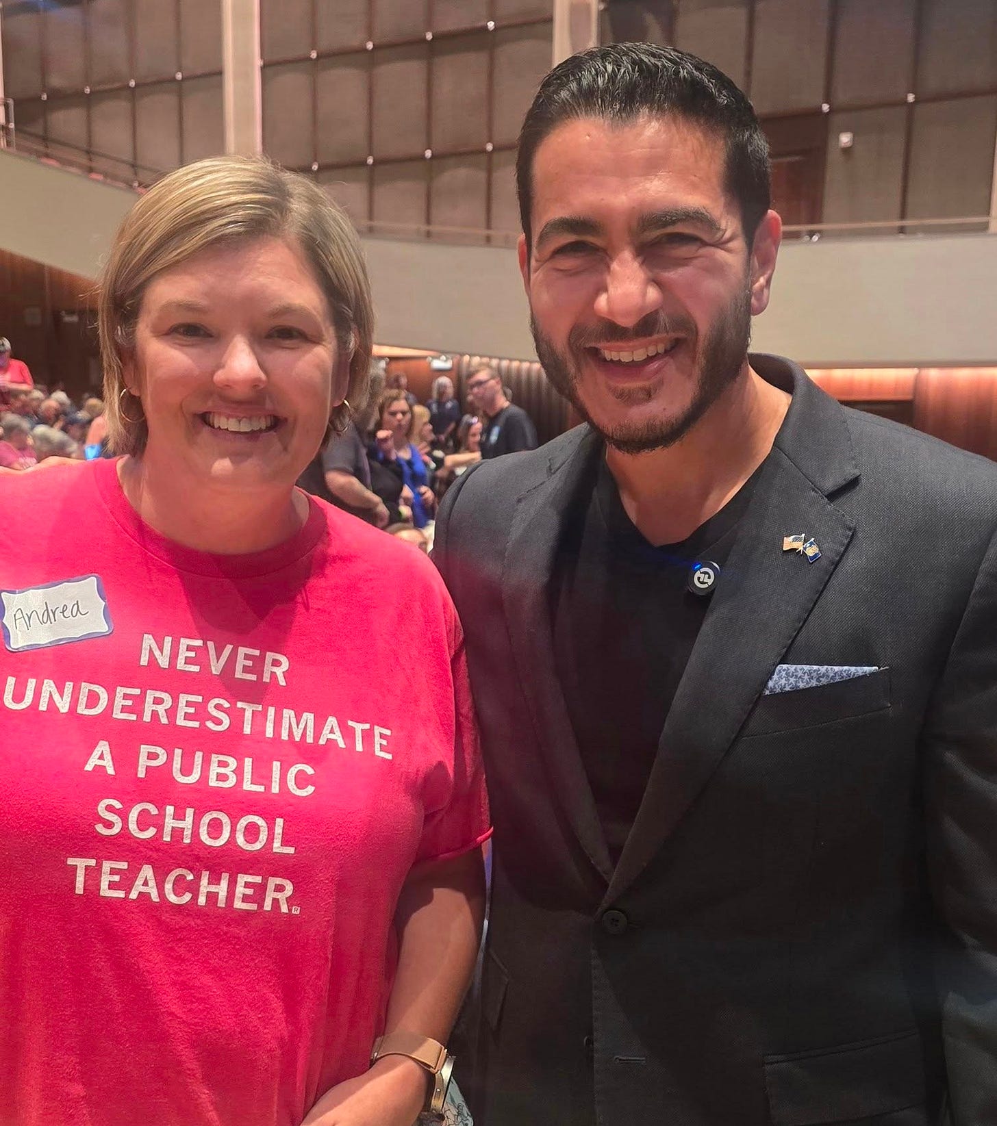 May be an image of 2 people and text that says '一代 Andred UNDERESTIMATE A PUBLIC NEVER SCHOOL TEACHER'