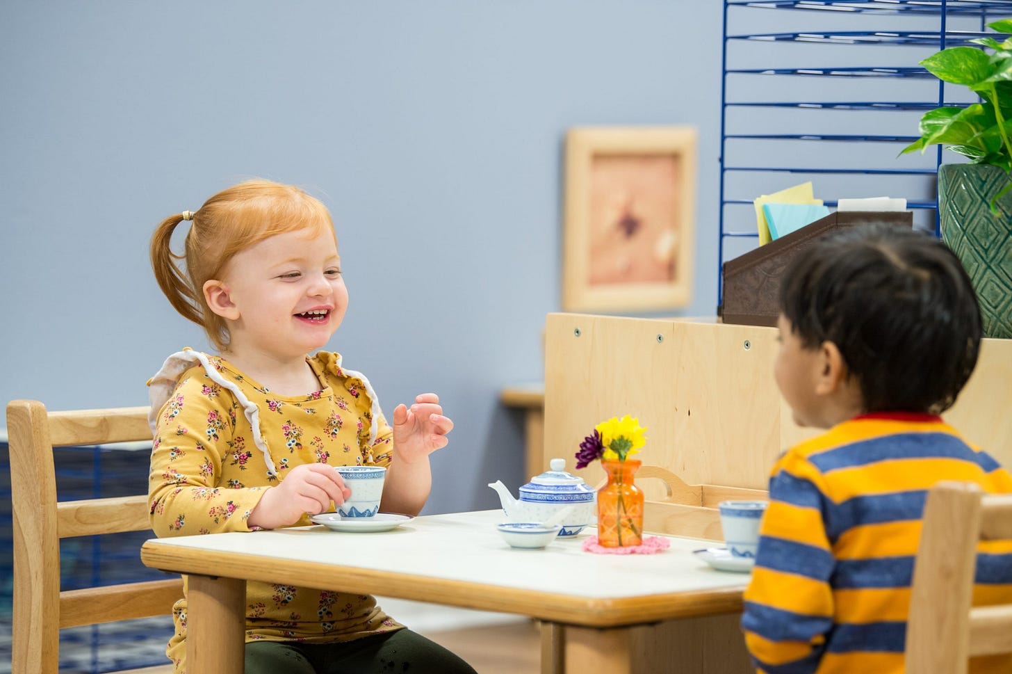 Children enjoying tea together during a Montessori social activity in the Guidepost Montessori experience Children enjoying tea together during a Montessori social activity in the Guidepost Montessori experience