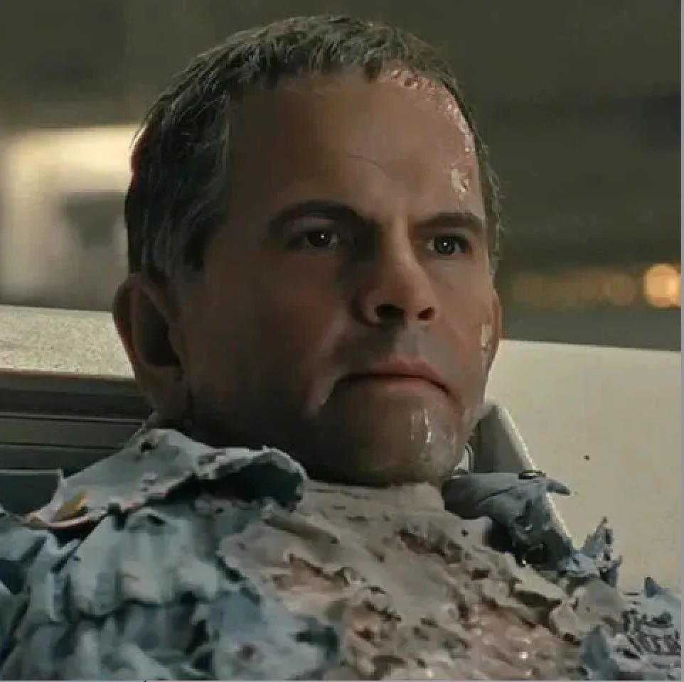 Ian Holmes face AI'd onto a badly damaged robot body, which is flaking and deteriorating