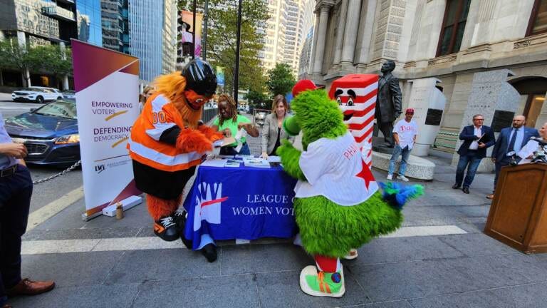 voter-registration-gritty-phanatic-t-macdonald-2022-09-20-1 Gritty and the Phillie Phanatic filling out their voter registration forms on September 20, 2022. (Tom MacDonald / WHYY)