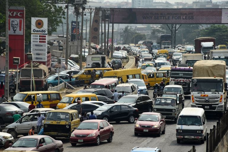 Drivers wait in line to buy fuel at and next to a filling station, causing traffic gridlock on Lagos' Ibadan expressway Drivers wait in line to buy fuel at and next to a filling station, causing traffic gridlock on Lagos' Ibadan expressway