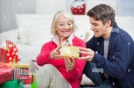 Image result for older woman giving son christmas present