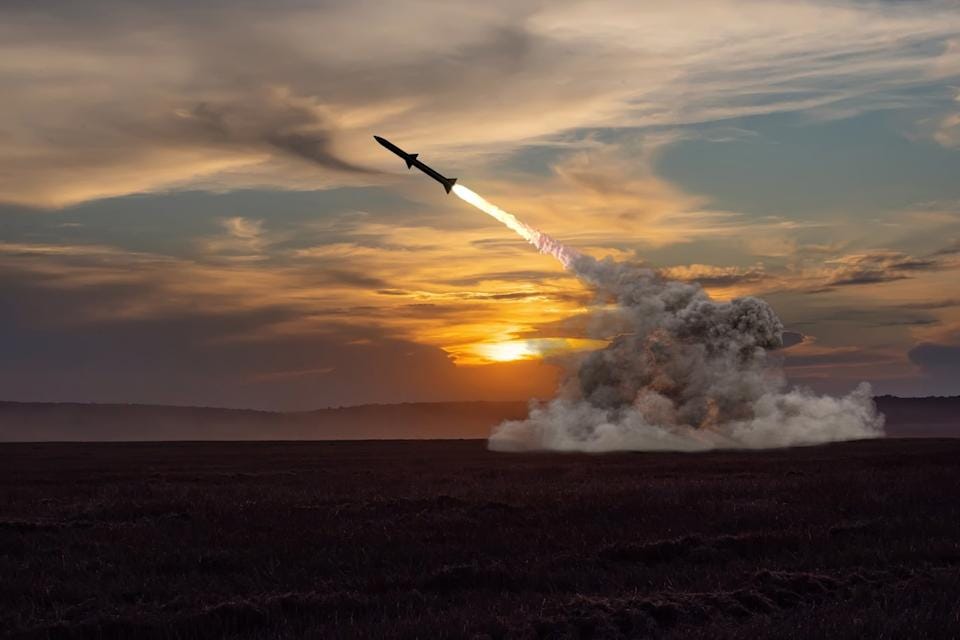 Rocket launching at sunset. Rocket launching at sunset.