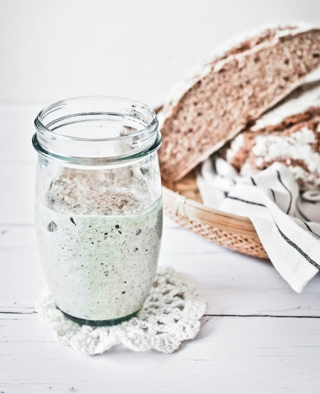 clear glass jar with green liquid