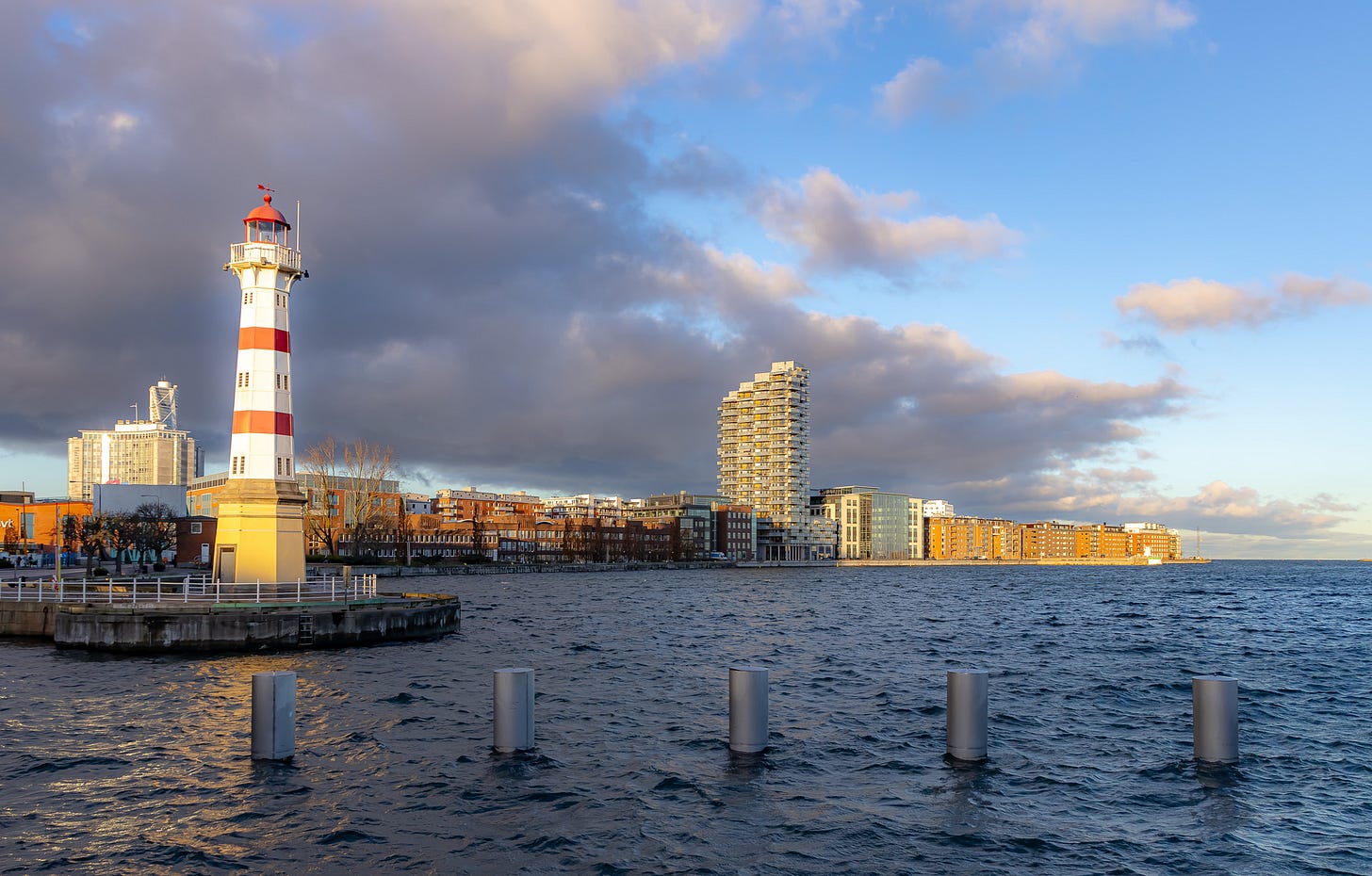 A lighthouse next to a body of water

AI-generated content may be incorrect.