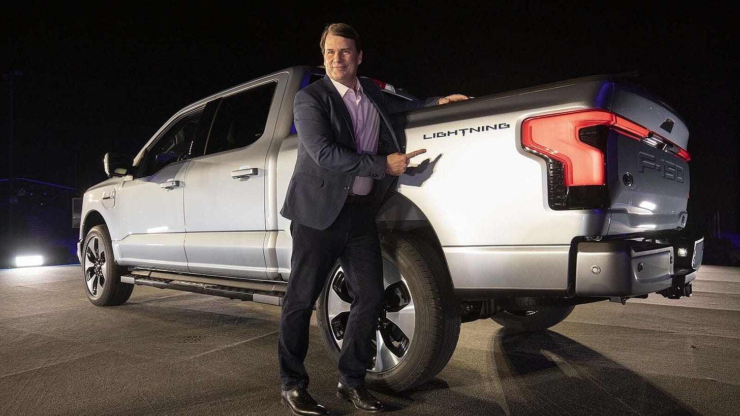 Ford CEO Jim Farley poses with one of his company's electric F-150 Lightning trucks. He said he was surprised recently when driving a Lightning himself how long it takes to charge it. Ford CEO Jim Farley poses with one of his company's electric F-150 Lightning trucks. He said he was surprised recently when driving a Lightning himself how long it takes to charge it.