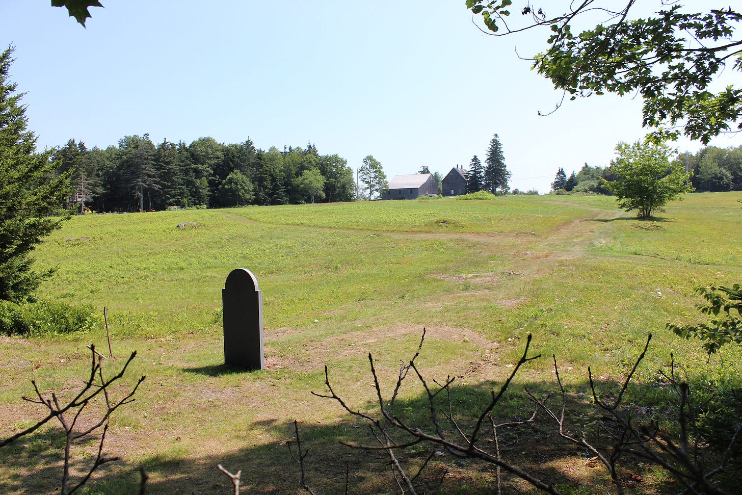 Grave of Andrew Wyeth, with the Olson House in the backgroun Grave of Andrew Wyeth, with the Olson House in the backgroun