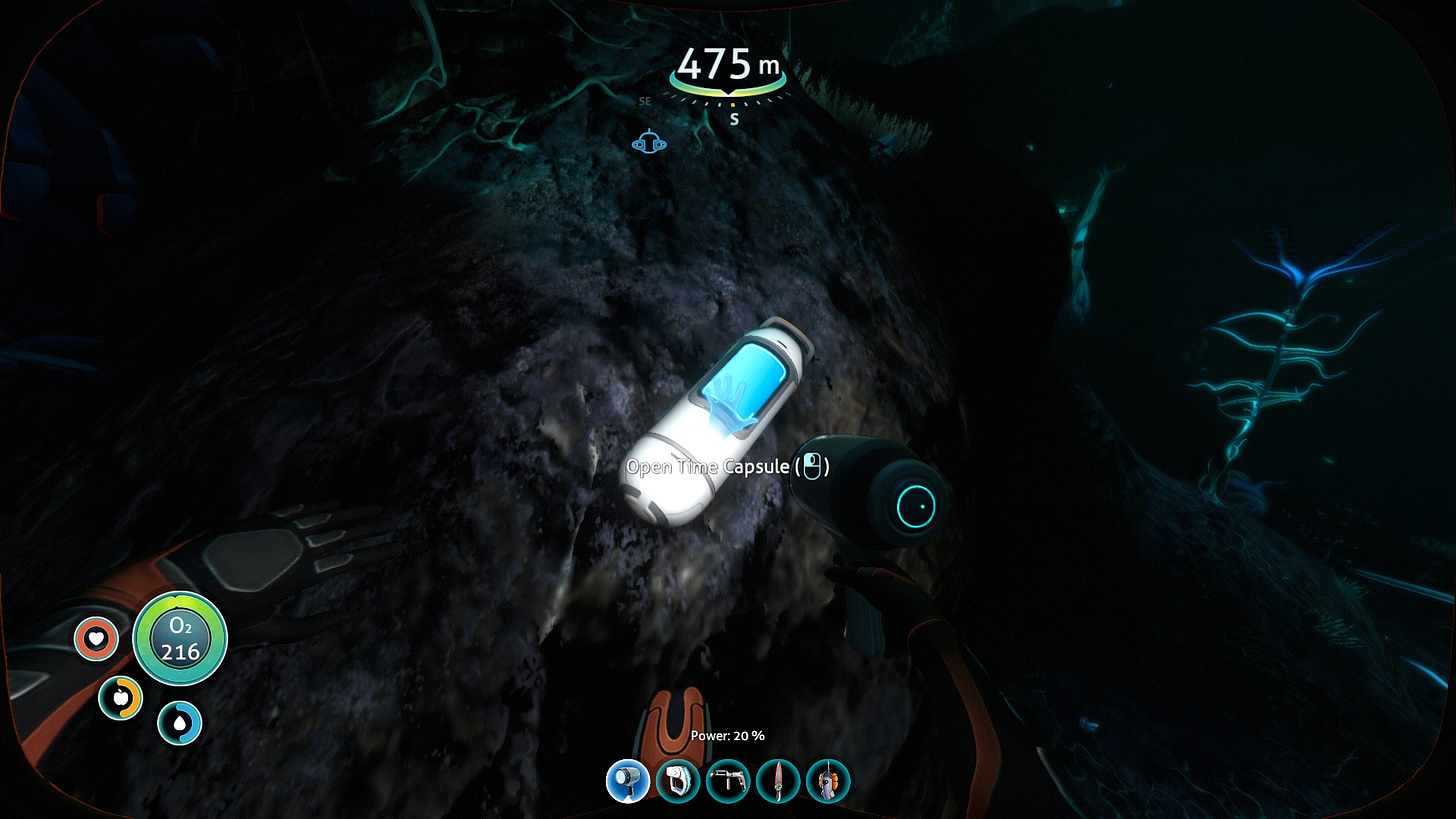 A screenshot of the game Subnautica showing a time capsule designed by the company Alterra deep in the Grand Reef biome of planet 4546B, seen through the player's breathing suit. A screenshot of the game Subnautica showing a time capsule designed by the company Alterra deep in the Grand Reef biome of planet 4546B, seen through the player's breathing suit.