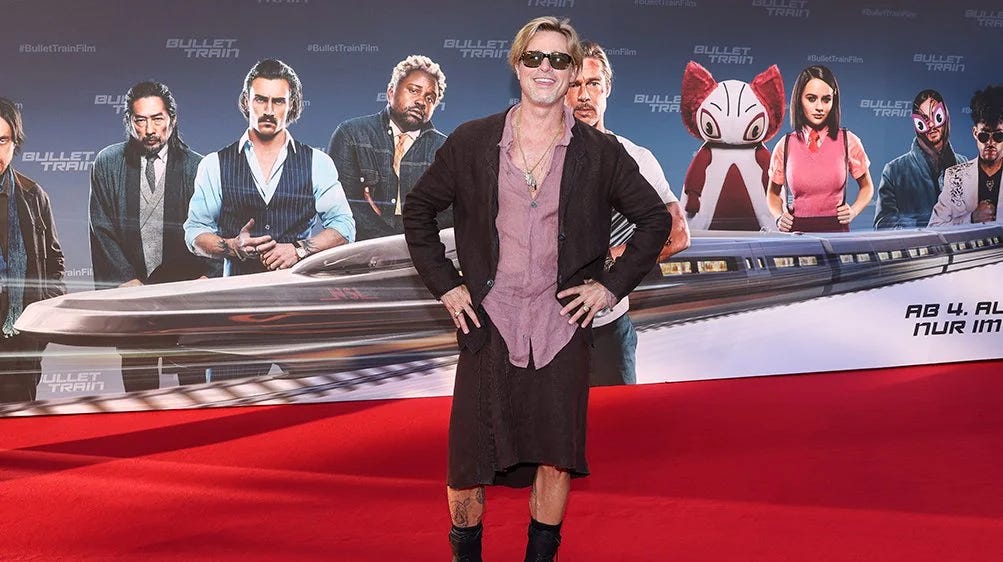 Brad Pitt in a skirt for the premiere of Bullet Train. Brad Pitt in a skirt for the premiere of Bullet Train.