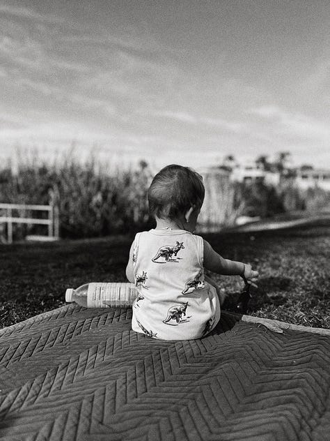baby boy in nature, with mama, & daddy.