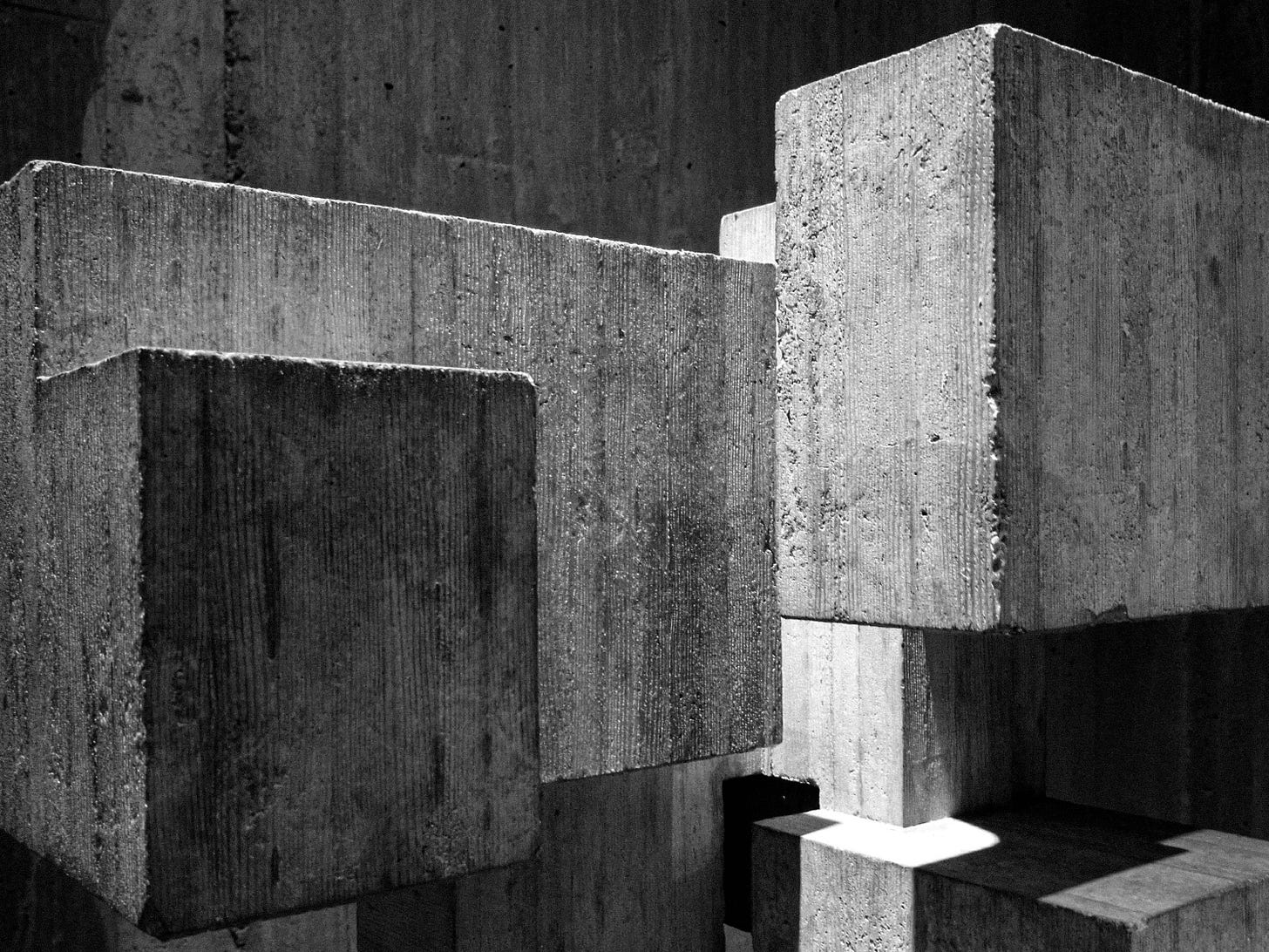 The foundation of a building. A metaphor for the foundational work that invisible work builds which is hard to measure. The Layer Beneath on Substack.