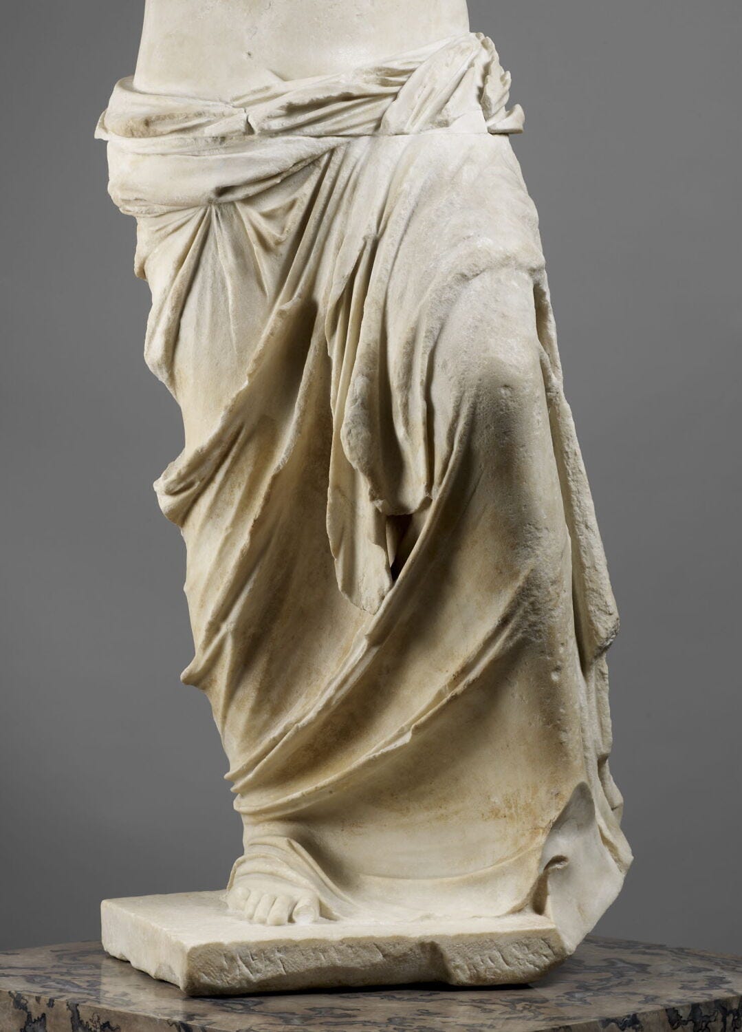 Lower half of the Venus de Milo, the draped marble skirt, photographed separately at the Louvre. Lower half of the Venus de Milo, the draped marble skirt, photographed separately at the Louvre.
