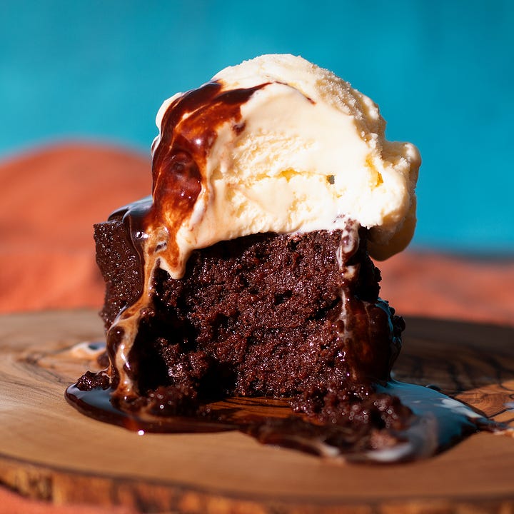 A bowl of creamy chicken stew with mushrooms and dark chocolate brownies topped with ice cream and hot fudge.