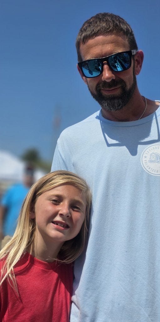 Anna Belle Stuart stands with her father, Boyd Stuart.