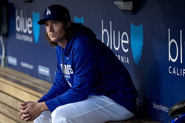 Los Angeles, CA Los Angeles Dodgers pitcher Tyler Glasnow sits in the dugout before an MLB game against the Kansas City Royals at UNIQLO Field at...