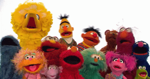 a group of sesame street characters including big bird are standing together a group of sesame street characters including big bird are standing together
