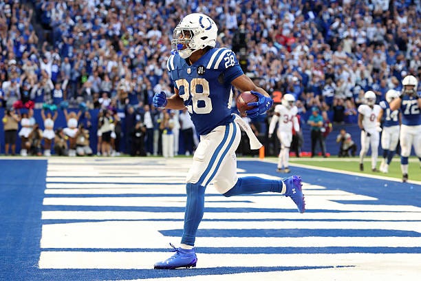 Jonathan Taylor of the Indianapolis Colts scores a touchdown against the Arizona Cardinals during the fourth quarter in the game at Lucas Oil Stadium...