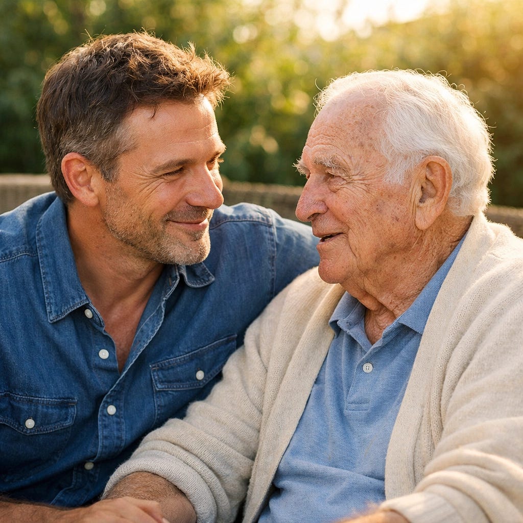 Adult son and elderly father talking on a sunlit patio, illustrating presence and support for aging parents.