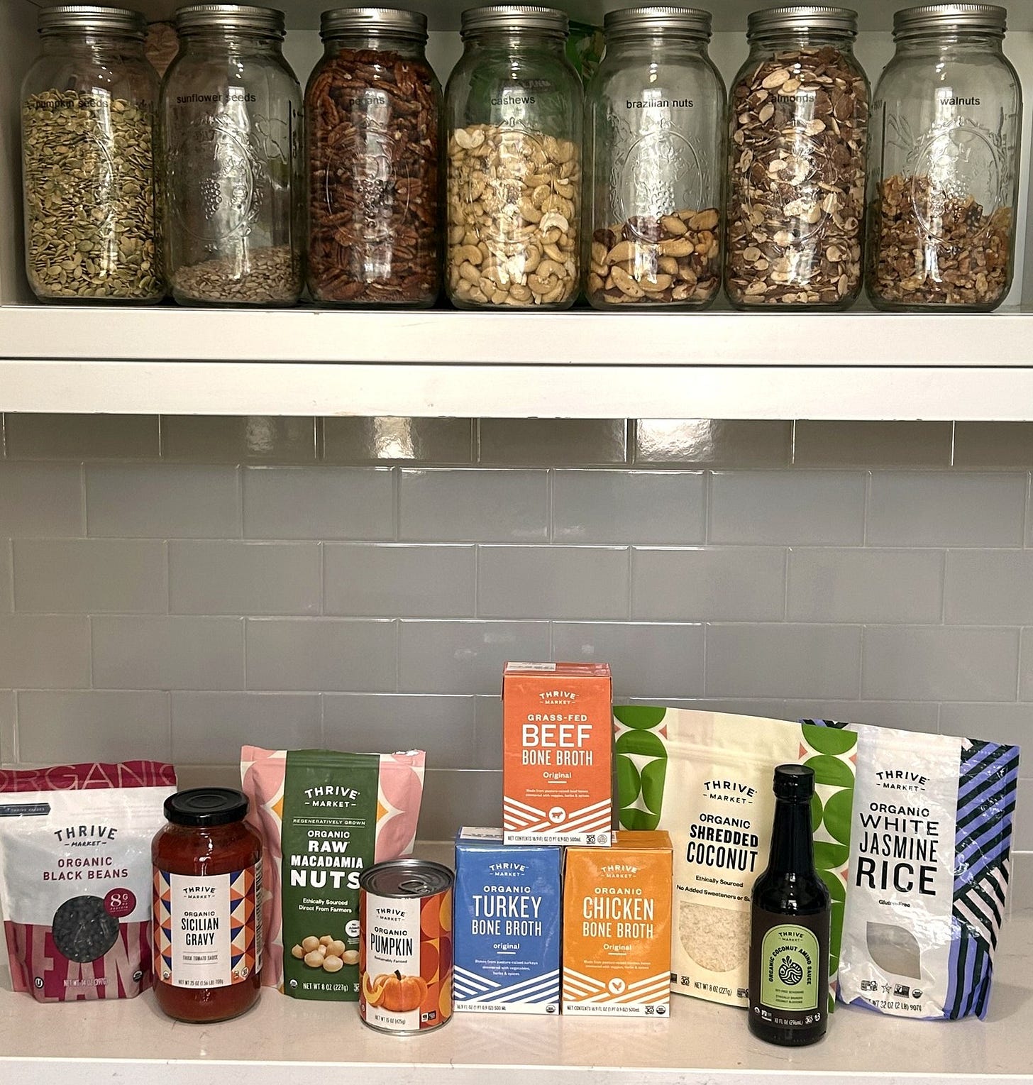 A home pantry stocked with Thrive Market groceries.