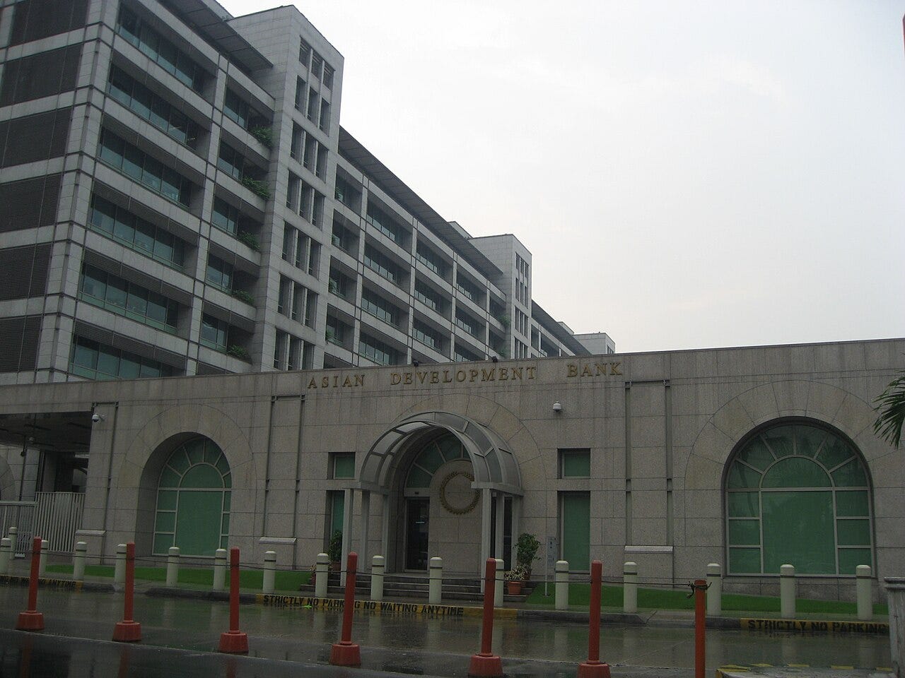 The main gate of the Asian Development Bank headquarters in Mandaluyong, Metro Manila The main gate of the Asian Development Bank headquarters in Mandaluyong, Metro Manila