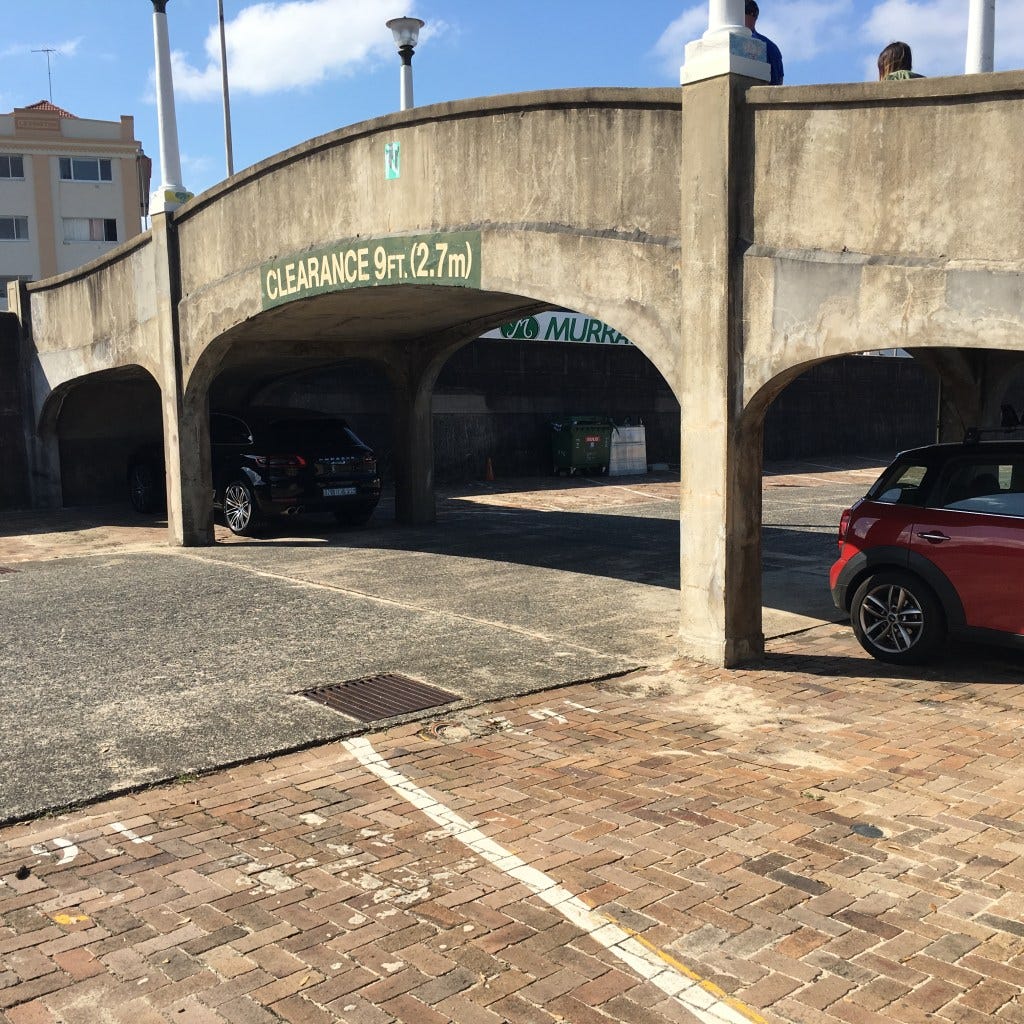 I take pictures of infrastructure. A pedestrian overpass at Bondi Beach parking lot, 2017. Based on the building across the street, I believe this is the same one the gunmen used in 2025, though maps show two similar overpasses. I take pictures of infrastructure. A pedestrian overpass at Bondi Beach parking lot, 2017. Based on the building across the street, I believe this is the same one the gunmen used in 2025, though maps show two similar overpasses.