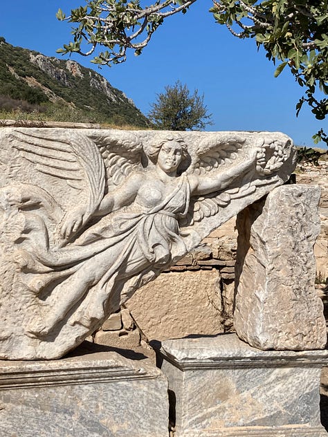 Various ceramics, vases, paintings, posters, iconography, statues, ruins, caves with wings
